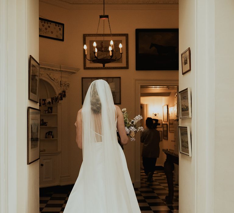 Bride in traditional wedding dress with wedding veil 