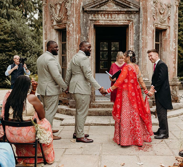 Outdoor wedding ceremony at Larmer Tree Gardens wedding venue in Wiltshire 