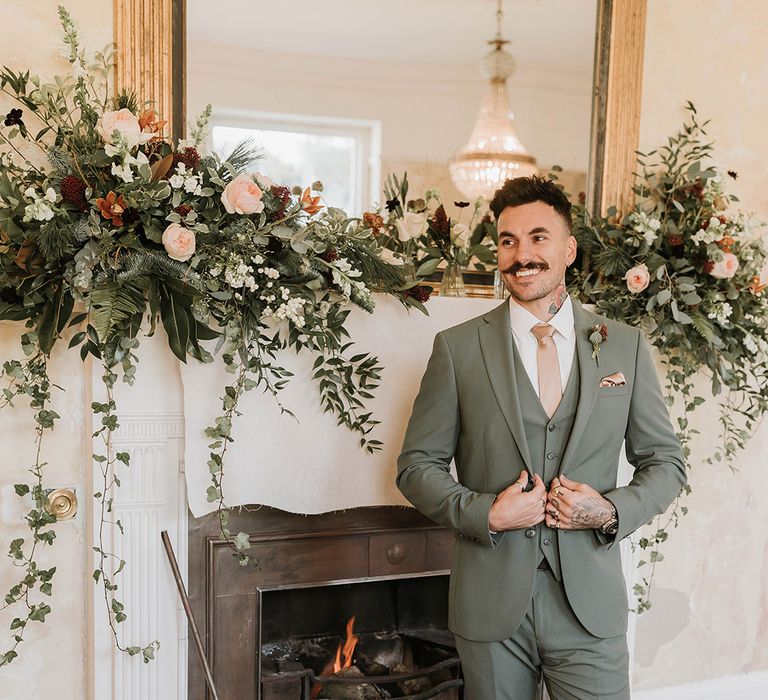 Green Christmas wedding theme with the groom wearing a green suit 