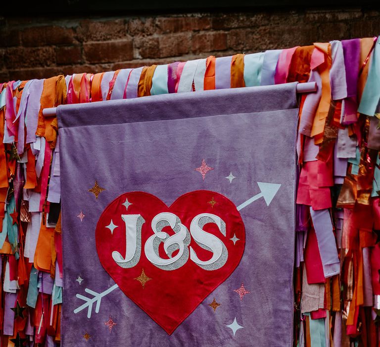 Customised light purple wedding banner with heart and their initials 