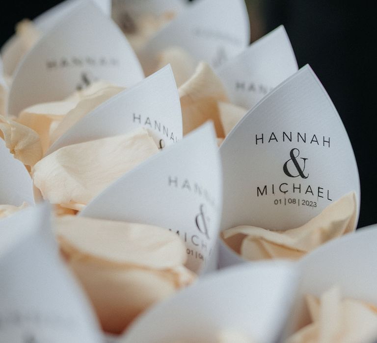 Customised confetti cones with the couple's initials 