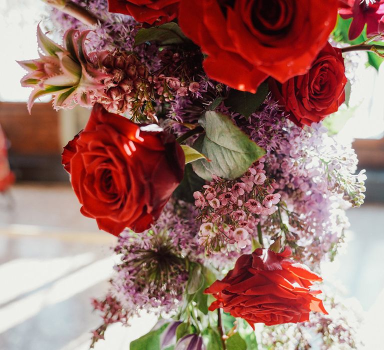 Red rose and pink wedding flower altar arrangements 