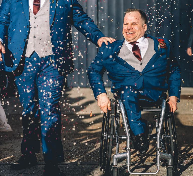 Two grooms wearing matching dark navy wedding suits for their LGBTQI gay wedding 