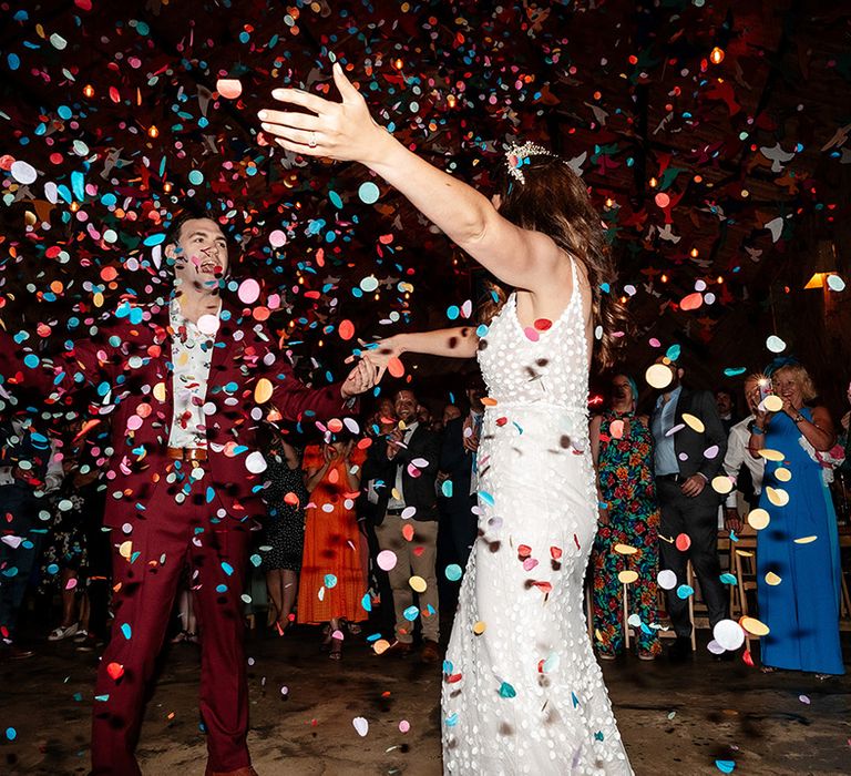 Colourful confetti moment during the bride and groom's first dance together 