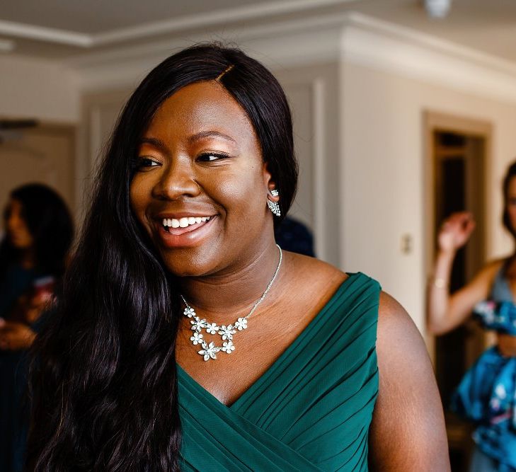 Bridesmaid on wedding morning in green dress 