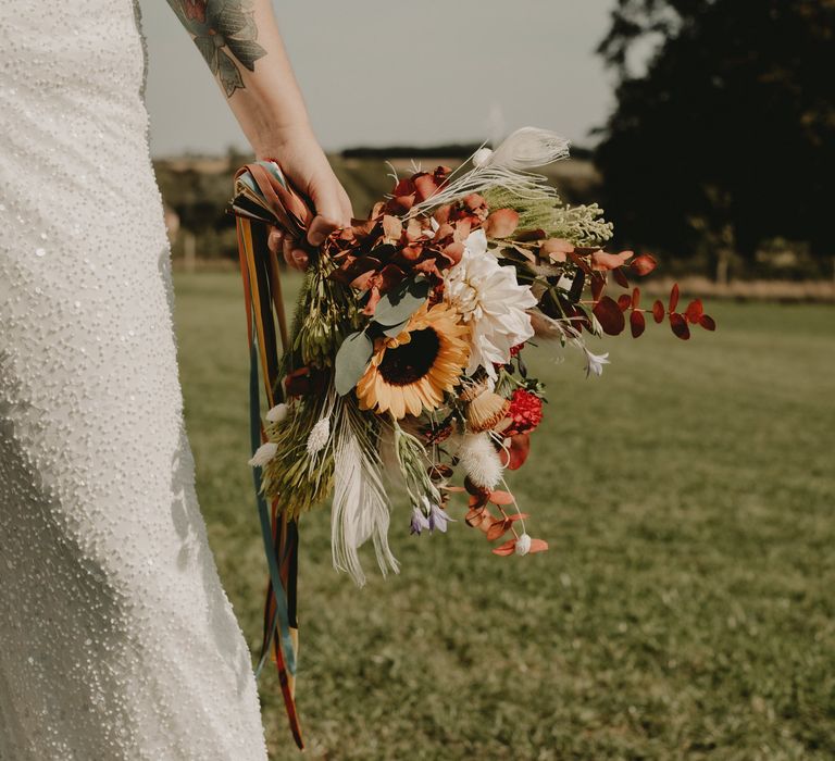 Wedding bouquet with sun flowers and wild flowers 