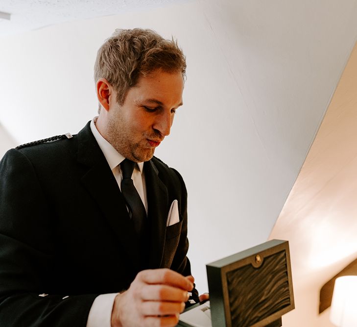 Groom opens his wedding gift