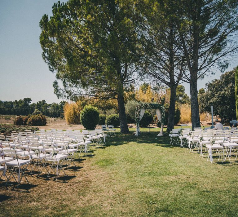 A romantic outdoor wedding ceremony at Le Mas De La Rose in Provence