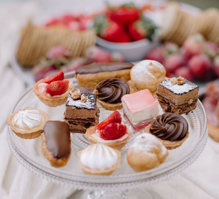 A cake stand of delicate French patisserie desserts