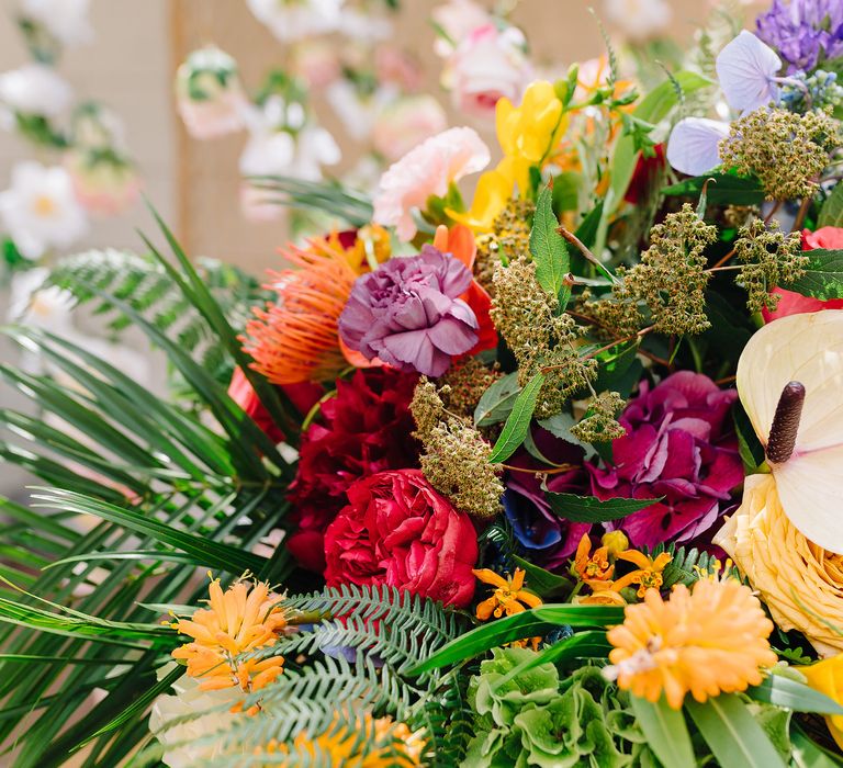 Colourful bouquet with green foliage and bright blooms