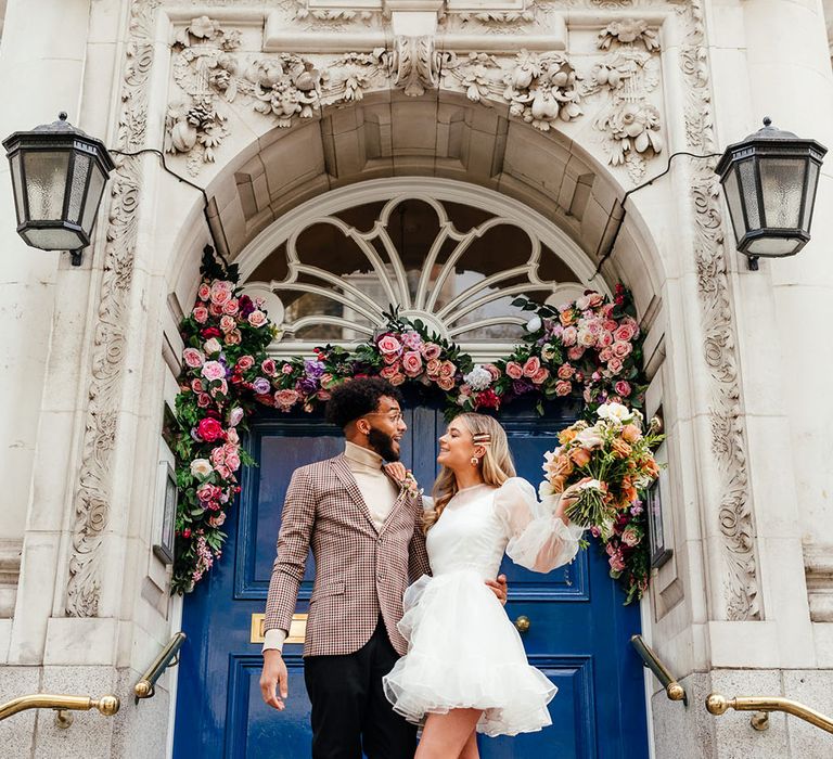 Marry Me In Chelsea Micro wedding with groom in check blazer and bride in short wedding dress and boots