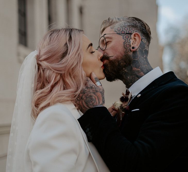 Close up of bride and groom kissing