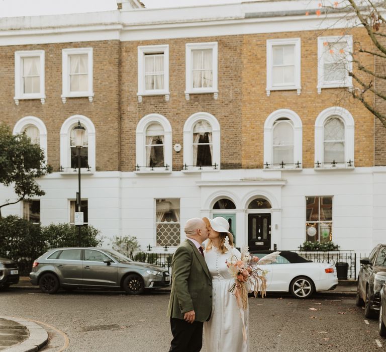 Bride & groom walk together through Chelsea