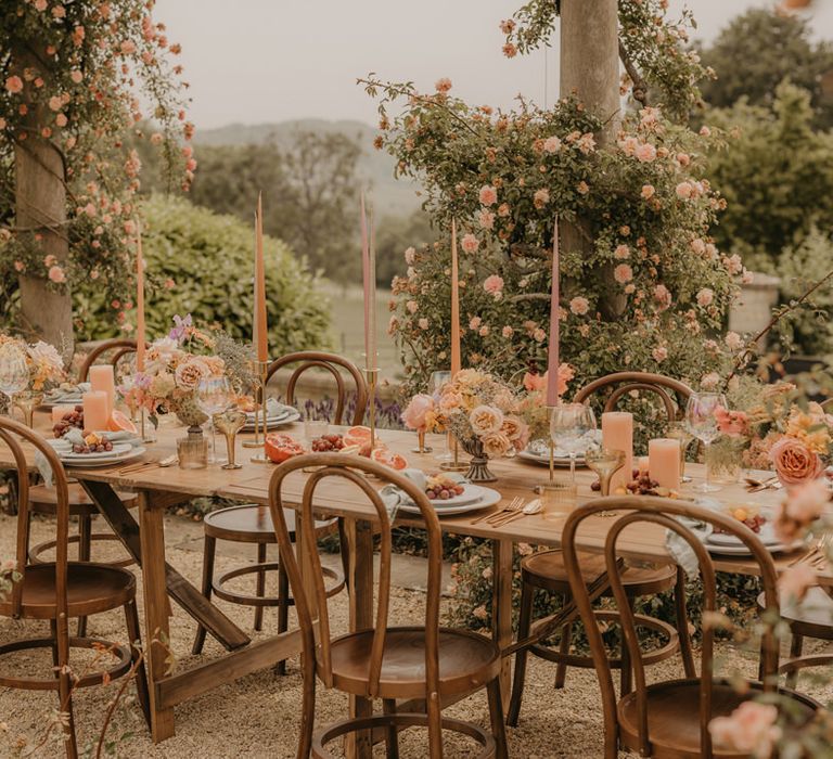 Pastel orange, pink, coral and peach wedding flowers and table decor with gold accents for summer wedding at Euridge Manor 