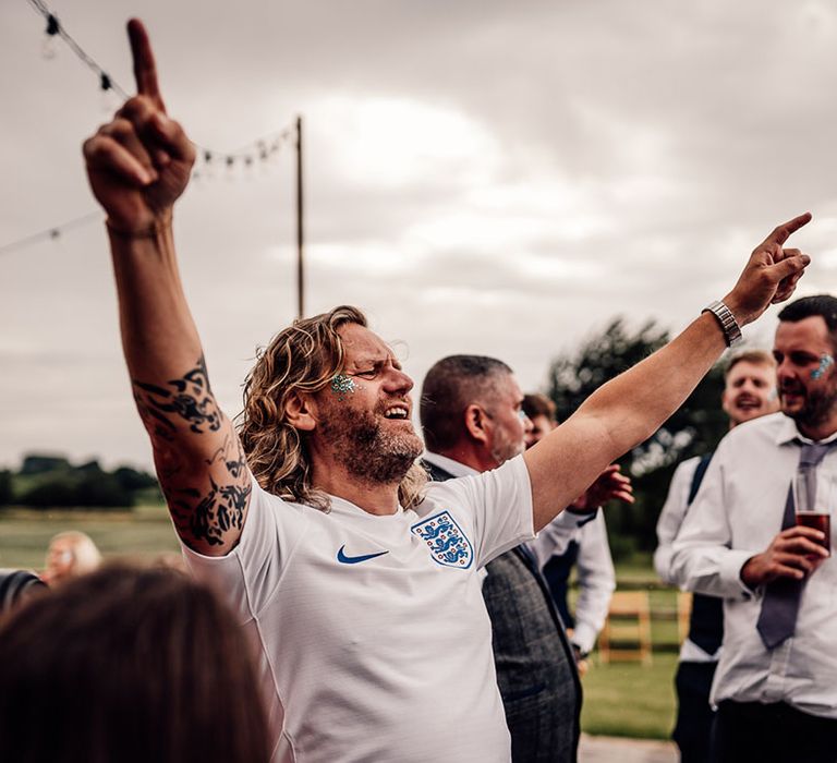 Groom celebrates in England football shirt