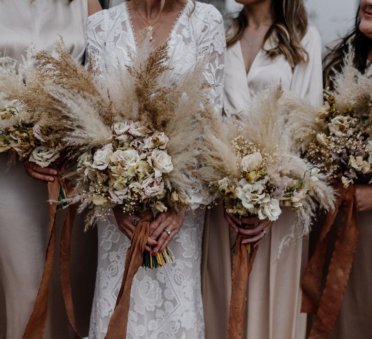 Neutral tone pampas grass bouquets for bridesmaids and bride