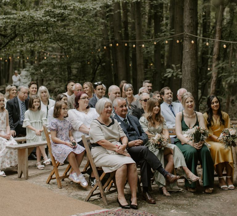 Wedding guests watch on during ceremony at The Dreys