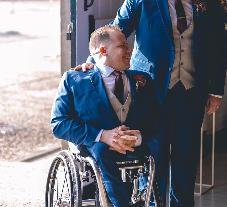 Grooms in matching blue wedding suits