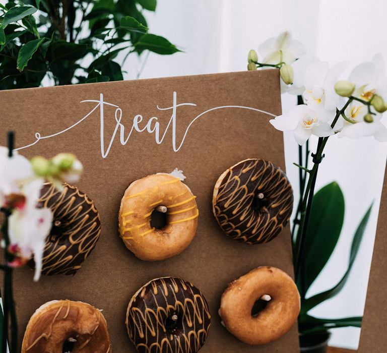 Glazed and chocolate doughnut wall with chocolate cupcake