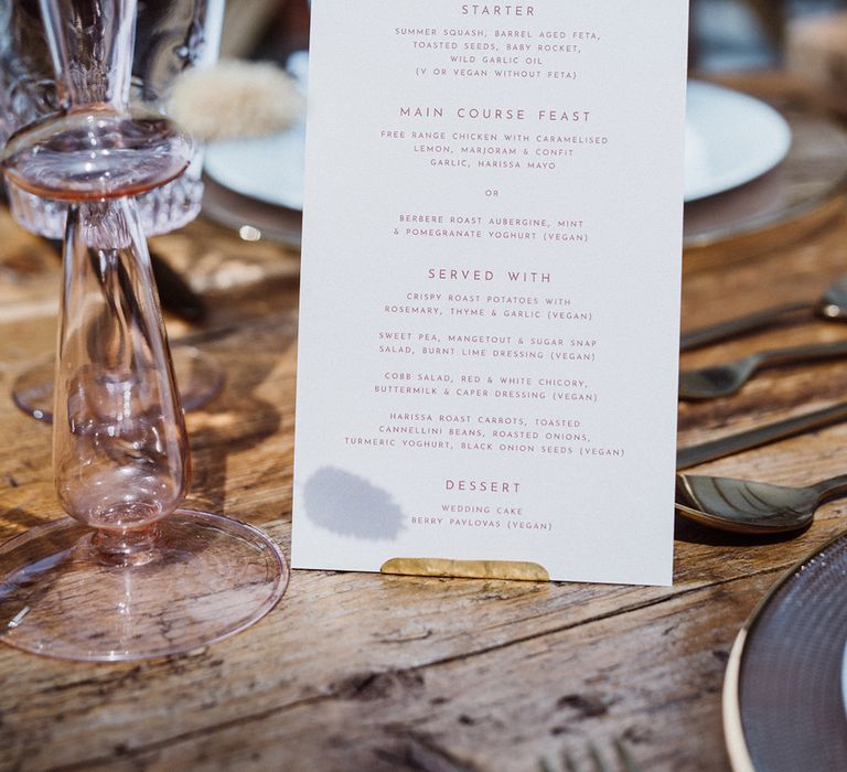 Pale pink menu card with pink glassware for the pastel theme wedding at Anran