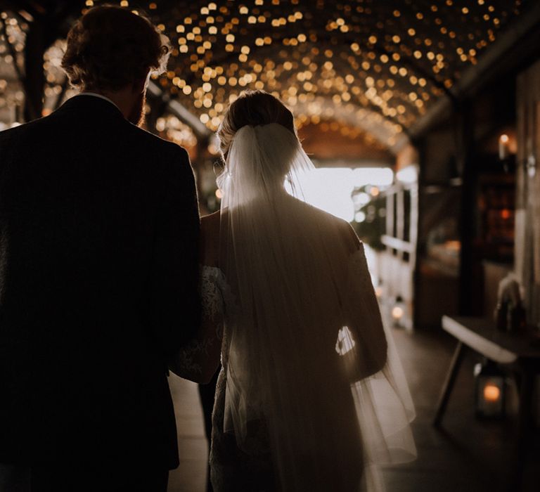 Fairy lights hung up at Stone Barn rustic barn wedding venue 