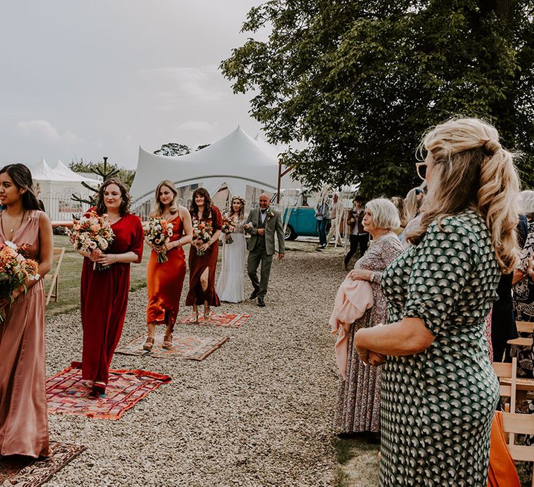 Autumn colour bridesmaid dresses with mismatched styling for boho wedding day outdoors 