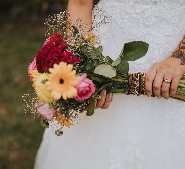 wedding bouquet with Gerberas, roses and dahlias wrapped in a Caribbean ribbon