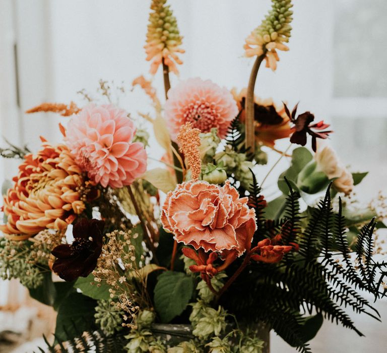 orange wildflowers with dahlias, red hot pokers and Chrysanthemums