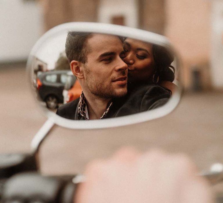 Bride and groom in the mirror of wedding motorbike at German editorial shoot with vinyl wedding arch