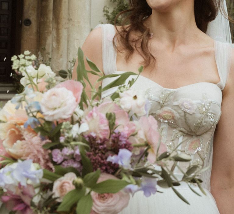 Bride in corset sequin flower custom wedding dress with pastel wedding bouquet 