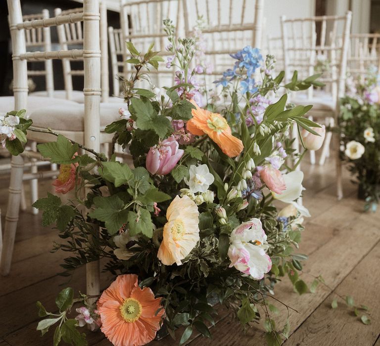 Pastel icelandic poppy in aisle flower arrangements for country house wedding 