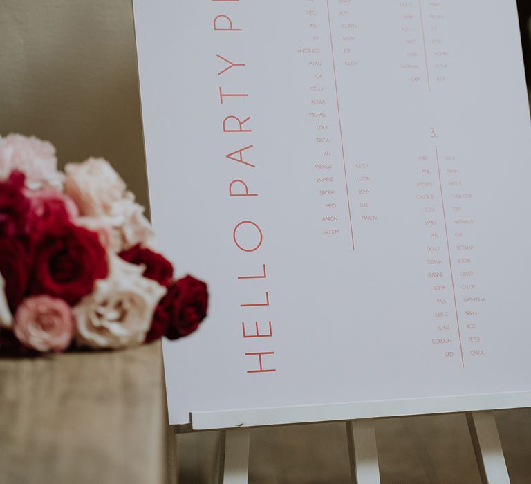 Minimalistic pink and red wedding seating chart for country house wedding 