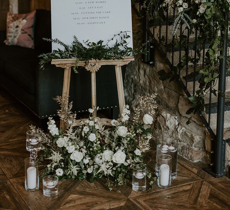 Minimalist wedding order of the day and welcome sign with white flower arrangements at Wharfedale Grange wedding venue 