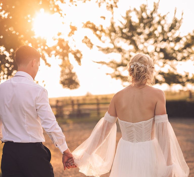 Golden hour photograph with loosely pinned wedding hairstyle