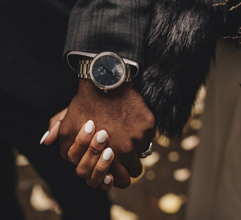 Bride with rounded white wedding nails for proposal 