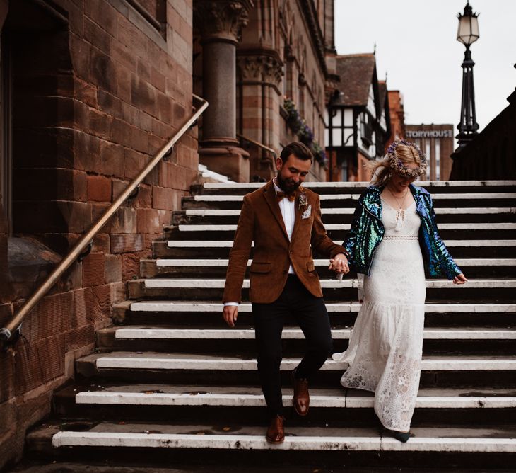 bride and groom walking down the stairs at Chester Town Hall