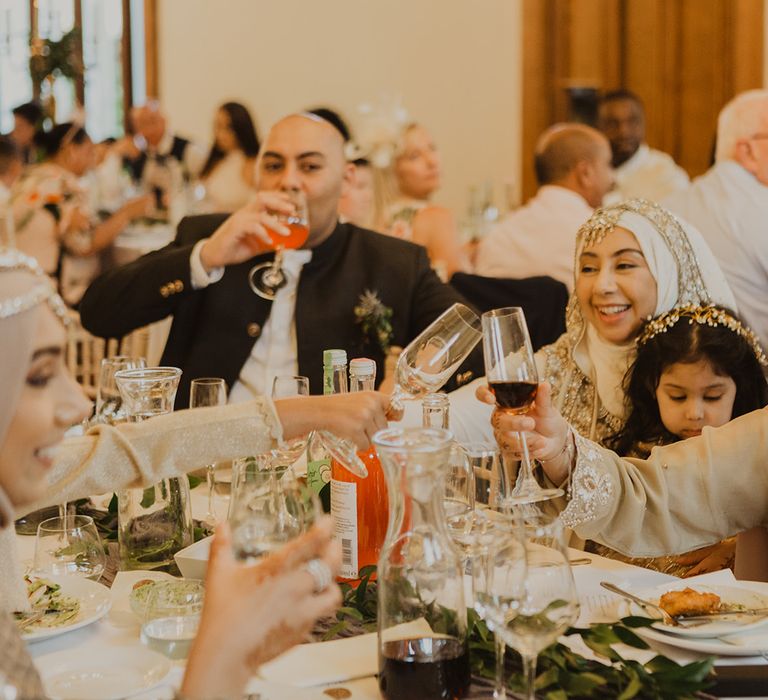 Wedding guests 'cheers' at multicultural wedding 