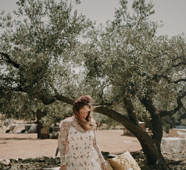 Bride stands in a boho chic wedding reception