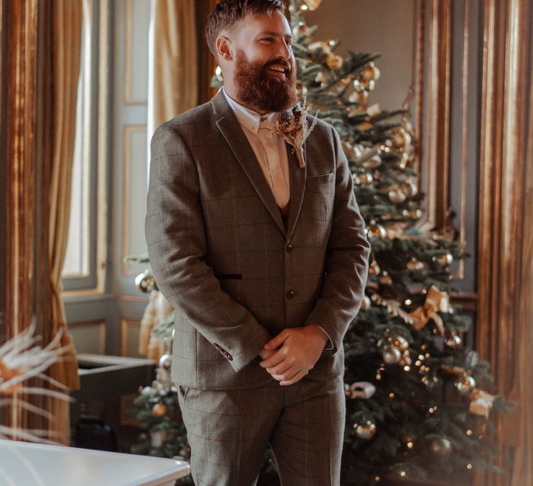 Groom waits at Cliveden House in Tweed suit 