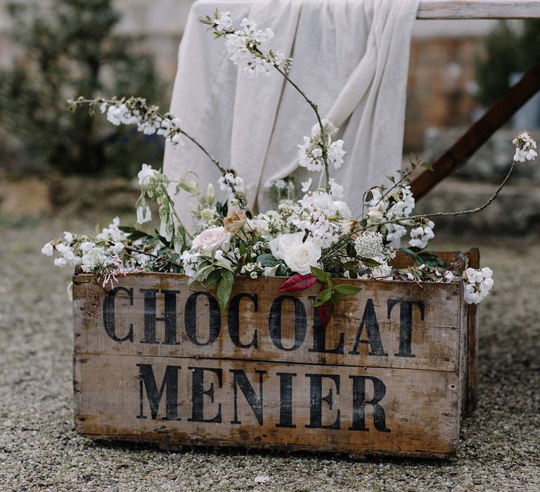 Old chocolate factory boxes were used for rustic decor details