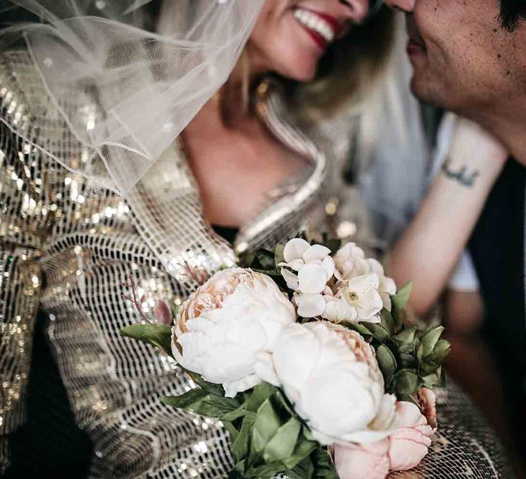 Blush wedding flowers for bride at elopement