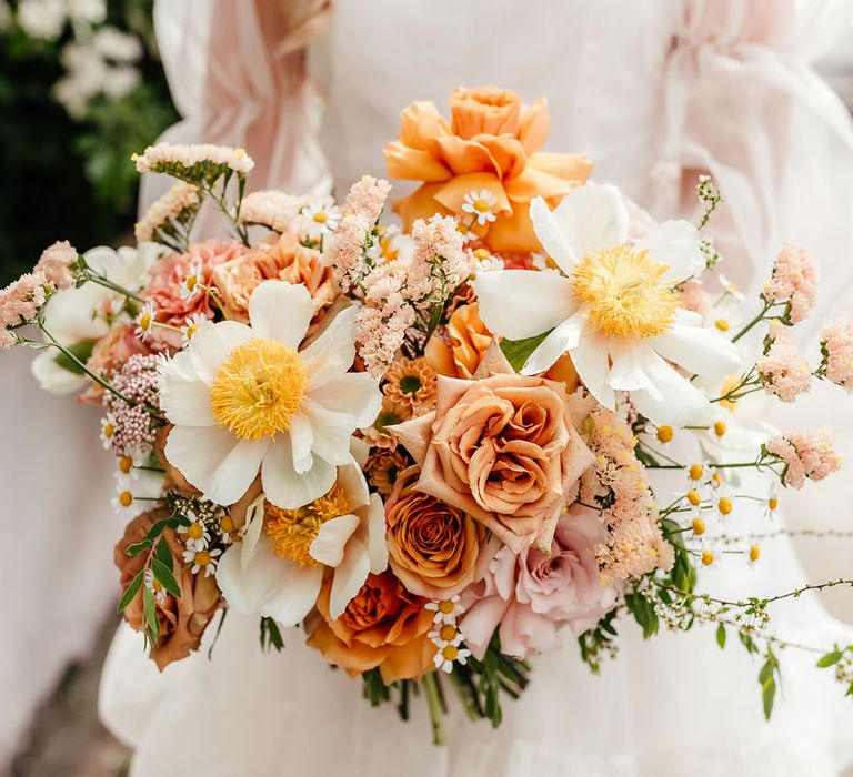 Orange and yellow wedding bouquet with roses and carnations by Bud Flora