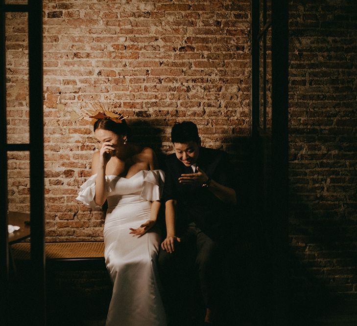 Asian Lesbian wedding portraits with brides laughing in the shadows 