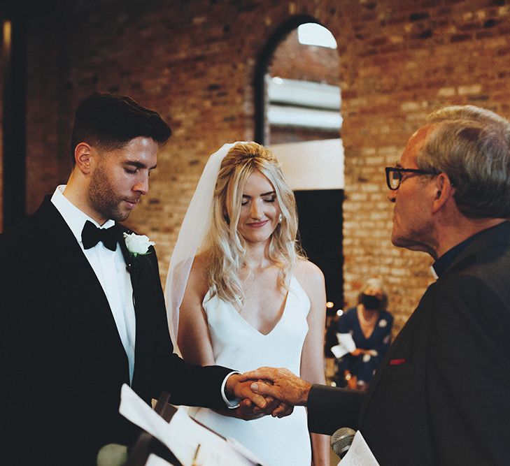 Bride and groom exchanging vows at Gas Street Church wedding ceremony in Birmingham 