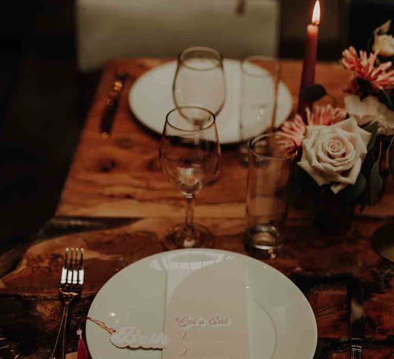 Wedding table place setting with blush florals and retro stationery