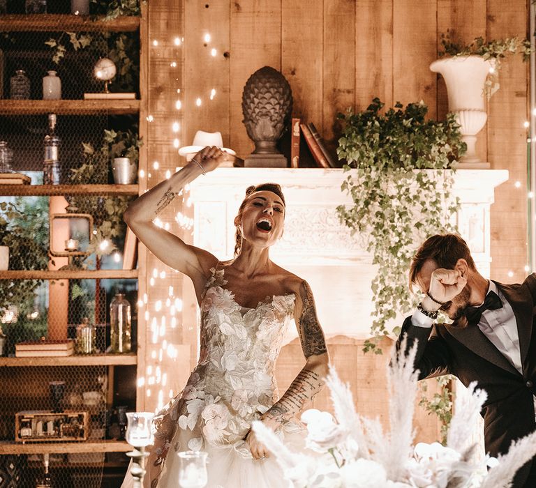 Bride & groom dance together on their wedding day during reception in Italy