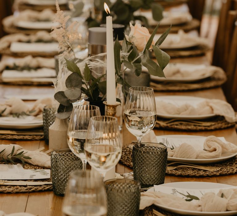 Rustic tablescape complete with woven placemats and greenery throughout  | Mark Bamforth Photography