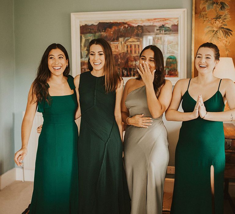 Bridesmaids see the bride for the first time on wedding day