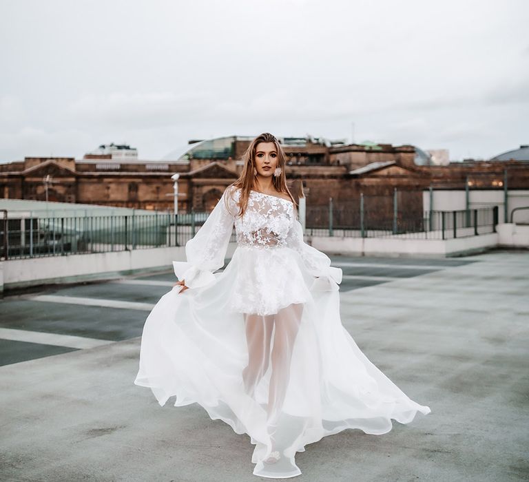 Daniel Chu wedding dress with short skirt, lace detail and and sheer layer 