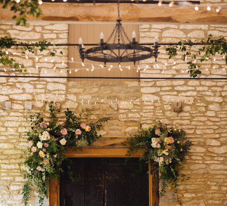 Caswell House wedding venue decorated with vines, fairylights and Spring flowers 